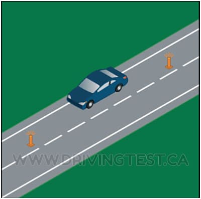 Test 1 - How far away from your vehicle should you place emergency flares or warning lamps if you have broken down?